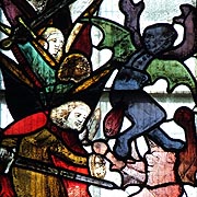 Angels attacking Two Demons from the Harrowing of Hell Light in Fairford Church